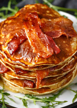Pancakes with crispy bacon and maple syrup in a plate. Morning Breakfast.の写真素材