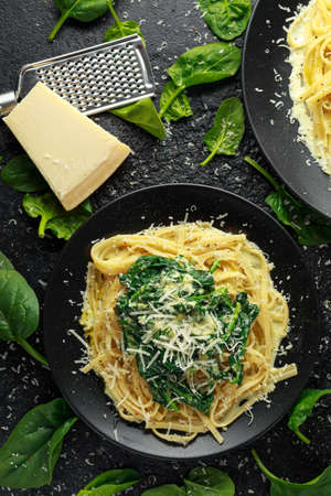 Tagliatelle pasta with spinach in cream sauce with parmesanの写真素材