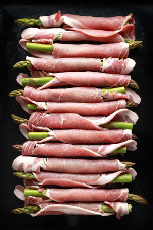 Raw Bacon wrapped green asparagus. view from topの写真素材