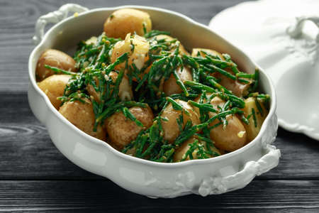 Boiled new potato with fresh samphire and garlicの写真素材