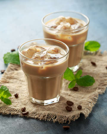 iced latte coffee in a glass with cold milk. Summer drink