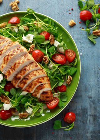 Fresh Grilled Chicken salad with tomatoes, feta cheese.の写真素材