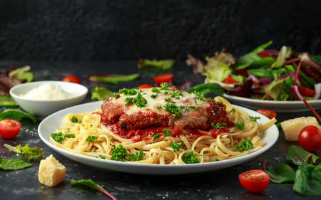 Chicken Parmesan with Cheese and Marinara Sauce served over spaghetti, pastaの写真素材