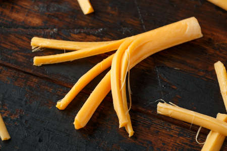 String Cheese on rustic wooden table. healthy snack.の写真素材
