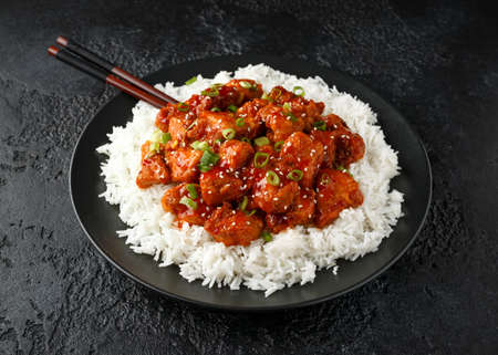 Tsos chicken with rice, green onion and broccoli