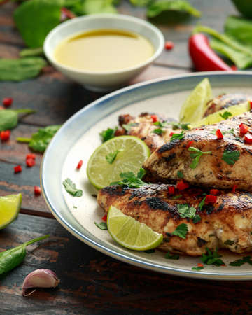 Homemade Grilled Chicken Breast in lime sauce with herbsの写真素材