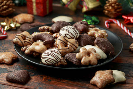 Christmas Gingerbread, lebkuchen with decoration, gifts on wooden rustic tableの写真素材