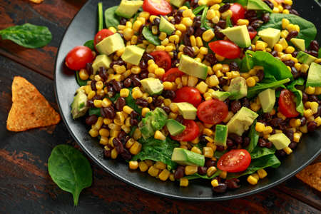 Mexican Salad with Avocado, Black Beans, sweet corn, spinach, tomatoes and Tortilla chipsの写真素材