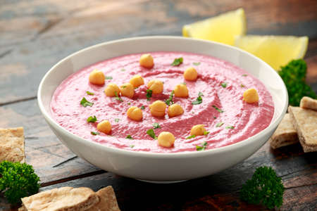 Beetroot Hummus with chickpea, olive oil, lemon and pita breadの写真素材