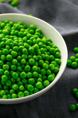 Green peas in white bowl. Healthy food.
