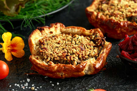 Butternut squash and spinach on beetroot chutney filling in crisp puff pastry vegetarian, vegan pie...