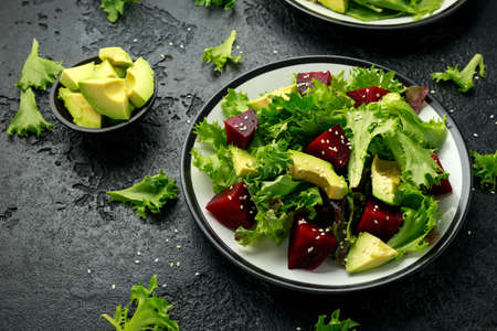 Vegetarian avocado and beet salad in plate. Healthy vegan foodの写真素材