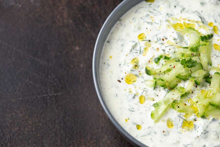Tzatzik yogurt cucumber white sauce in bowlの写真素材