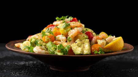 Prawn avocado salad with tomato cherry and herbs. Healthy foodの写真素材