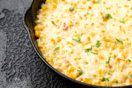Korean Corn Cheese in cast iron skillet frying panの写真素材