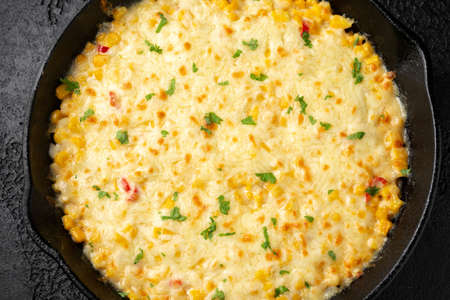 Korean Corn Cheese in cast iron skillet frying panの写真素材