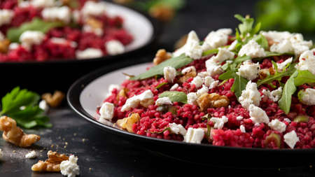 Bulgur salad with beetroot, walnuts, arugula and feta cheese. Healthy diet foodの写真素材