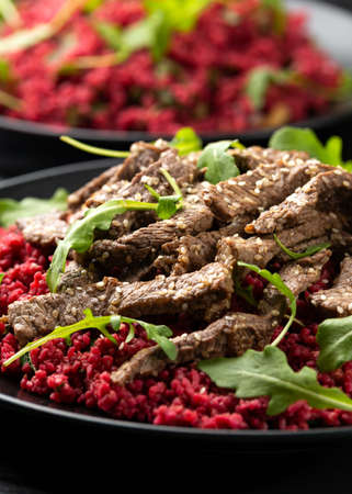 Bulgur salad with beetroot and roast beef. Healthy diet foodの写真素材