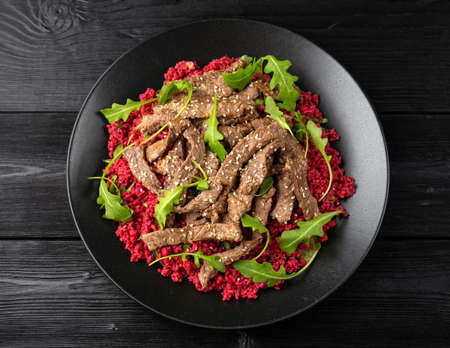 Bulgur salad with beetroot and roast beef. Healthy diet foodの写真素材