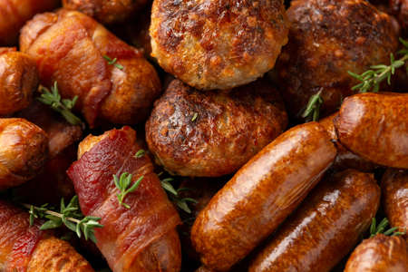 Pigs in Blankets, cocktail sausages and meatballs on plate. Party foodの写真素材