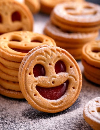 Tasty Biscuit face cookies with jam and sugar powder. Sweet pastries food.