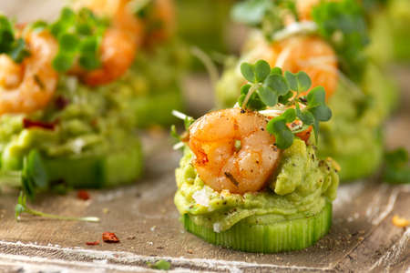 Canape with prawn, cucumber and avocado guacamole, party food, finger foodの写真素材