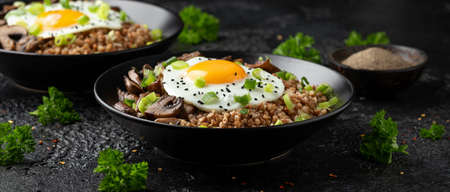 Bowl of Buckwheat with mushrooms, onion and egg. Healthy food