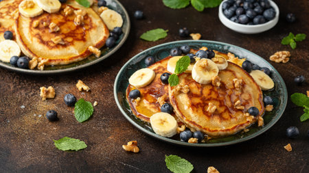 American pancakes with banana, blueberry, walnut and honey. Healthy morning breakfast