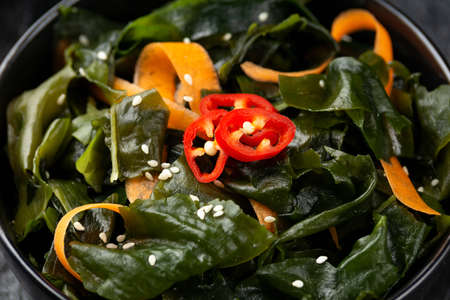 Wakame Seaweed salad with carrots, sesame seeds and sauce. Healthy food.の写真素材