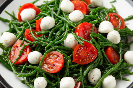 Fresh Samphire salad with cherry tomatoes and mozzarella. Healthy food.