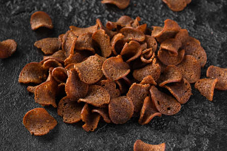 Garlic dark bread crisps, finger party food, beer snackの写真素材