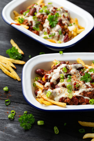 Chili Cheese Potato Fries topped with hot minced beef and cheese sauceの写真素材