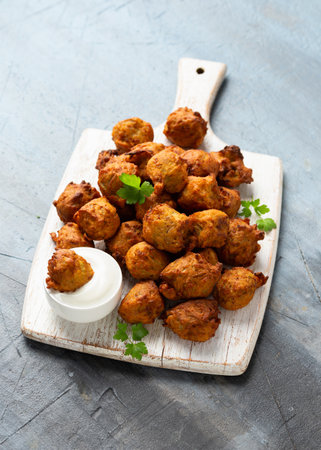 Fried fragrant Crispy Onion bhaji, vegetarian, vegan Indian party foodの写真素材