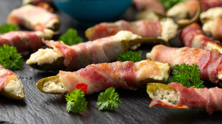 Homemade Bacon Wrapped Jalapeno Poppers with Cream Cheese and herbs.の写真素材