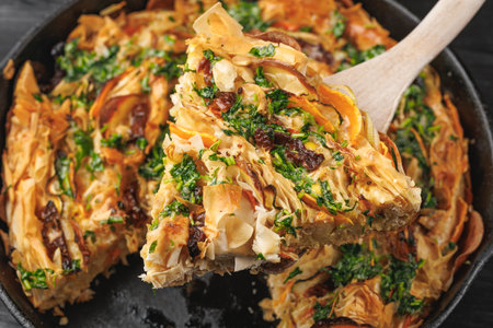 Filo pastry Veggie crinkle cake served with garlic and parsley butter on top