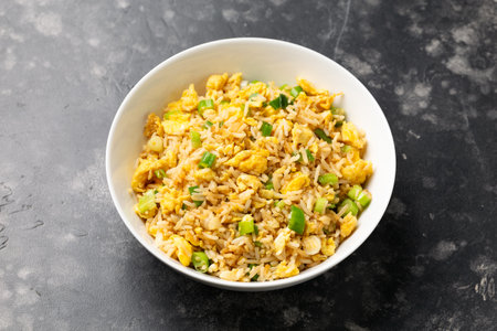 Egg fried rice with garlic, ginger, spring onion and soy sauce. Asian foodの写真素材