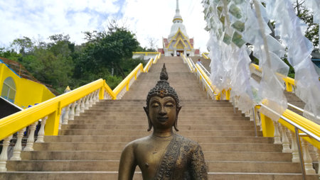 buddha statue in front of stair to templeのeditorial素材