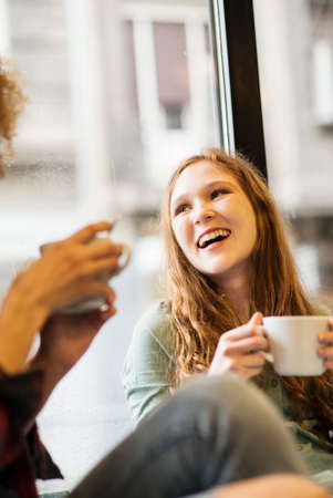 Two friends smiling togetherの写真素材