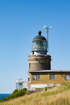 A lighthouse with house on a rock in Swedenの写真素材