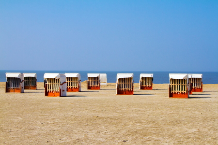 Empty beach chairs on the beachの写真素材