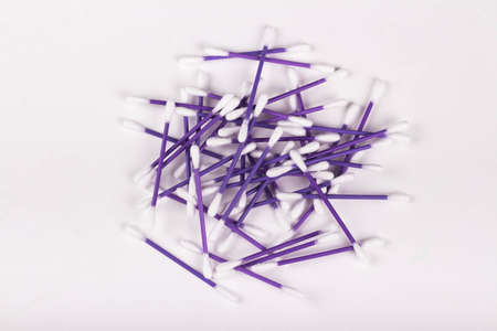 a heap of purple cotton buds on a white background, hygiene conceptの写真素材