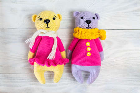 knitted bears knitted toy, amigurumi, on white wooden background