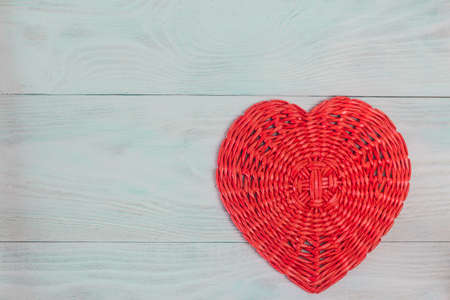 Wicker paper tube red heart on white wood boards, love and wedding concept, Valentine's day, background.の写真素材