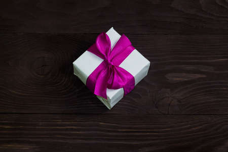 Theme of celebrations and gifts: exclusive gift Packed in white box with purple ribbon, beautiful...