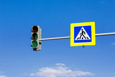 Urban pedestrian crossing with traffic lights.