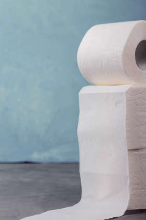 toilet paper rolls on a turquoise background, close-upの写真素材