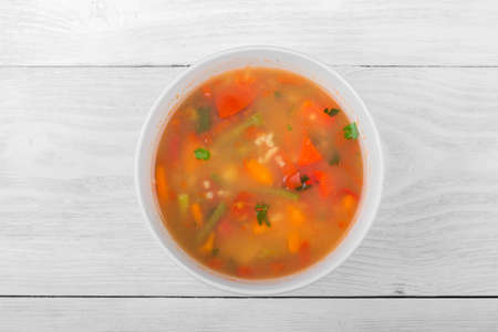 Vegetable soup with sliced carrots, peppers, tomatoes, beans and rice. Vegetable foodの写真素材