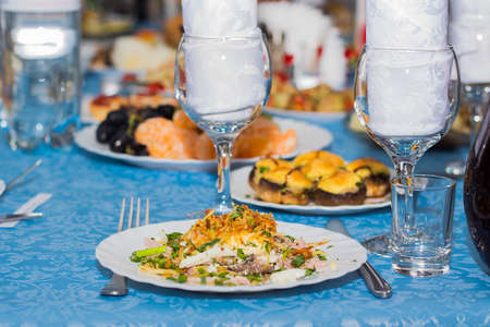 The range of different dishes on the table with a blue tablecloth, restaurant, benket, buffet