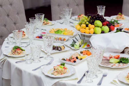 Delicious dishes on the festive table in the restaurant. Serving table. Wedding table, Banquet....