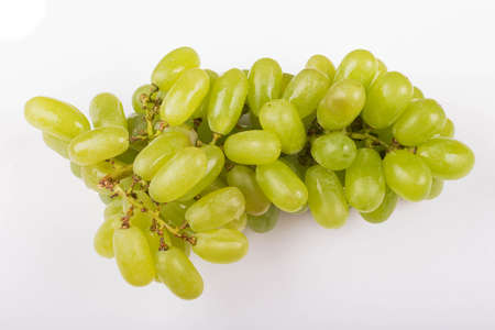 Fresh green grapes on white background